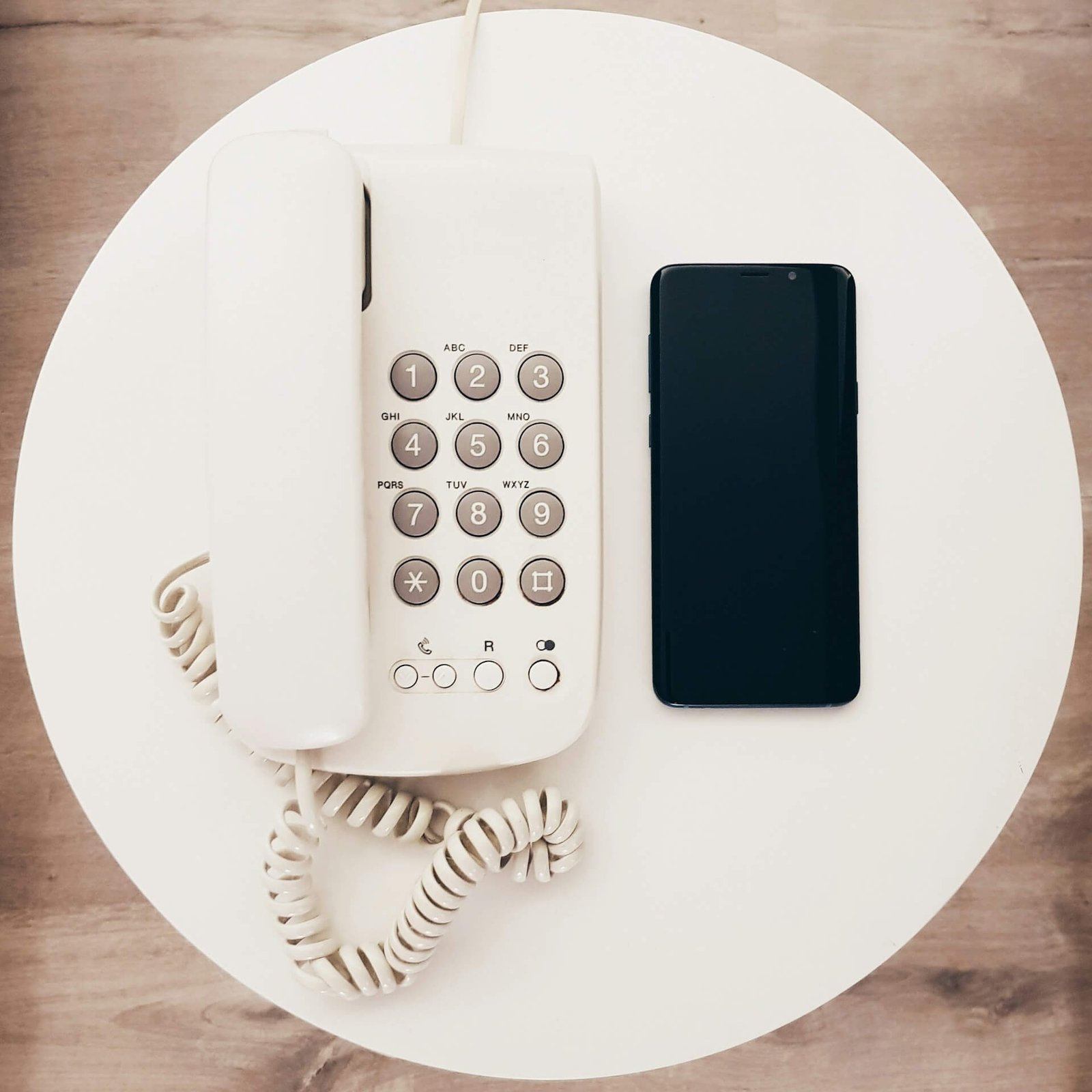 Telephone and smartphone on a table